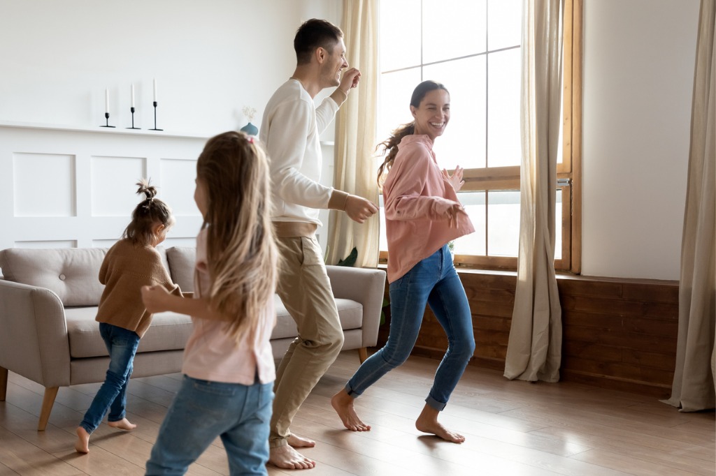 Family dancing on comfortable LVT flooring